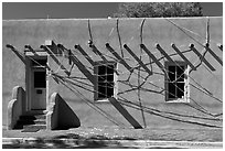 Adobe building tied up with plastic bags. Santa Fe, New Mexico, USA ( black and white)