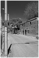 Street with Oldest House sign. Santa Fe, New Mexico, USA (black and white)