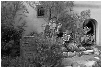 Desert plants and inscription, Church San Felipe de Neri. Albuquerque, New Mexico, USA ( black and white)