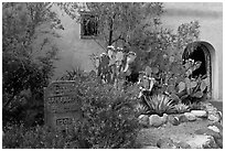 Desert plants and inscription, Church San Felipe de Neri. Albuquerque, New Mexico, USA (black and white)