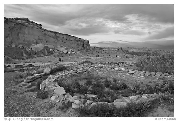 Great Kiva and cliff at sunset, Pueblo Bonito. Chaco Culture National Historic Park, New Mexico, USA (black and white)
