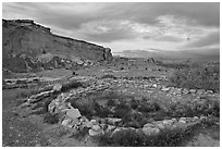 Great Kiva and cliff at sunset, Pueblo Bonito. Chaco Culture National Historic Park, New Mexico, USA (black and white)