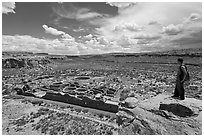 Man overlooking Chetro Ketl. Chaco Culture National Historic Park, New Mexico, USA ( black and white)