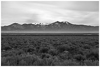 Sagebrush plateau incised by Rio Grande Gorge and Sangre De Cristo Mountains. Rio Grande Del Norte National Monument, New Mexico, USA ( black and white)