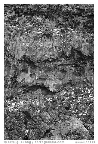 Lava cliff with tube entrance. El Malpais National Monument, New Mexico, USA