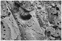 Volcanic tuff cliff with multitude of caves. Bandelier National Monument, New Mexico, USA ( black and white)