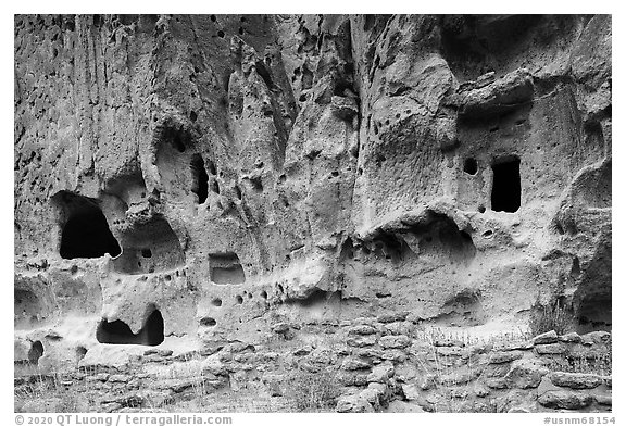 Walls built on Frijoles Canyon floor and dwellings in cavates. Bandelier National Monument, New Mexico, USA