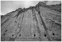Cliff with bean holes and cavates. Bandelier National Monument, New Mexico, USA ( black and white)