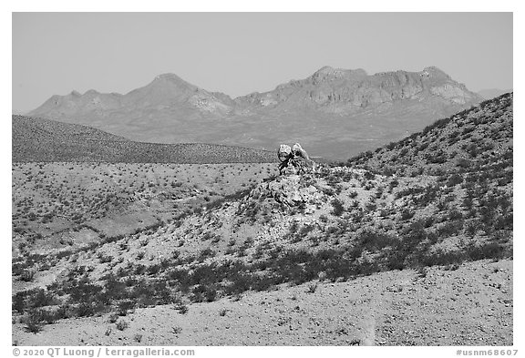 Rock pinnacle and Dona Ana Peak from below Picacho Mountain. Organ Mountains Desert Peaks National Monument, New Mexico, USA