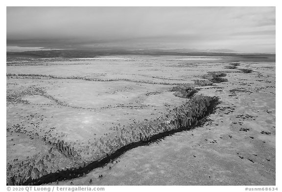 Aerial view of Pinabetal Mesa cut by Rio San Antonio. Rio Grande Del Norte National Monument, New Mexico, USA (black and white)