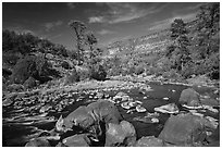Rio Grande flowing between boulders near Big Arsenic Spring. Rio Grande Del Norte National Monument, New Mexico, USA ( black and white)
