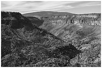 Gorge, cliffs, and shield volcano. Rio Grande Del Norte National Monument, New Mexico, USA ( black and white)