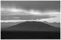 Ute Mountain with rain clouds at sunrise. Rio Grande Del Norte National Monument, New Mexico, USA ( black and white)
