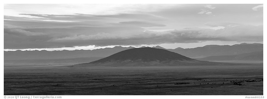 Ute Mountain, Taos Plateau, and Sangre de Cristo Mountains with rain clouds. Rio Grande Del Norte National Monument, New Mexico, USA