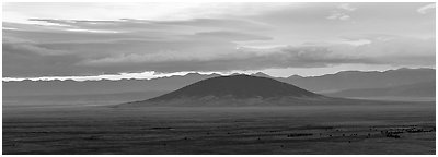 Ute Mountain, Taos Plateau, and Sangre de Cristo Mountains with rain clouds. Rio Grande Del Norte National Monument, New Mexico, USA (Panoramic black and white)