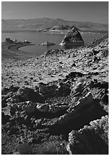 Tufa rock and pyramid. Pyramid Lake, Nevada, USA (black and white)