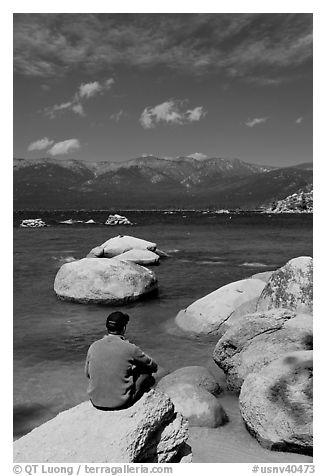 Man sitting on boulder, Sand Harbor, Lake Tahoe-Nevada State Park, Nevada. USA (black and white)