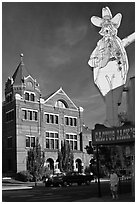 Giant Cactus Jack sign and brick building. Carson City, Nevada, USA (black and white)