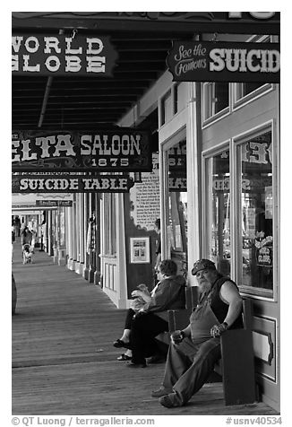 Arcade with suicide table sign. Virginia City, Nevada, USA (black and white)