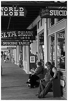 Arcade with suicide table sign. Virginia City, Nevada, USA ( black and white)