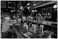 Man sitting at bar. Virginia City, Nevada, USA (black and white)