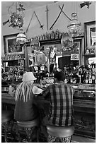 Man and woman sitting in saloon. Virginia City, Nevada, USA ( black and white)
