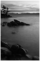 Sunset over lake with boulders, Sand Harbor, East Shore, Lake Tahoe, Nevada. USA (black and white)