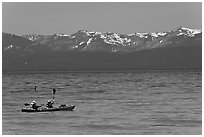 Kayak, turquoise waters and snowy mountains, East Shore, Lake Tahoe, Nevada. USA (black and white)