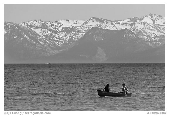 Canoe and snowy mountains, Lake Tahoe, Nevada. USA