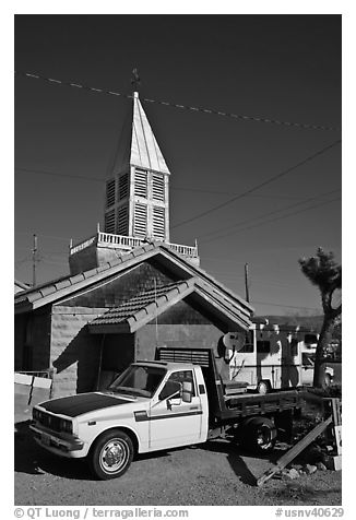 Truck and house with bell-tower, Beatty. Nevada, USA (black and white)