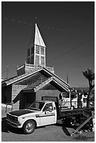 Truck and house with bell-tower, Beatty. Nevada, USA (black and white)