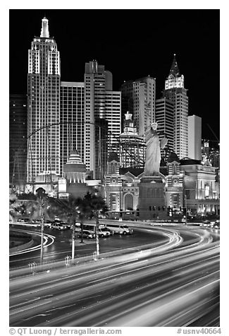 Traffic light trails and New York New York casino at night. Las Vegas, Nevada, USA (black and white)