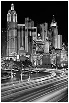 Traffic light trails and New York New York casino at night. Las Vegas, Nevada, USA ( black and white)