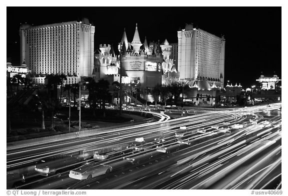 Traffic light trails and Excalibur casino at night. Las Vegas, Nevada, USA (black and white)