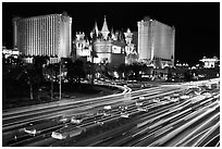 Traffic light trails and Excalibur casino at night. Las Vegas, Nevada, USA (black and white)