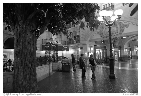 Man and woman standing on plaza inside Paris casino. Las Vegas, Nevada, USA