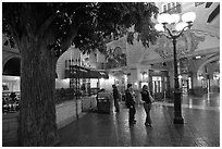 Man and woman standing on plaza inside Paris casino. Las Vegas, Nevada, USA ( black and white)