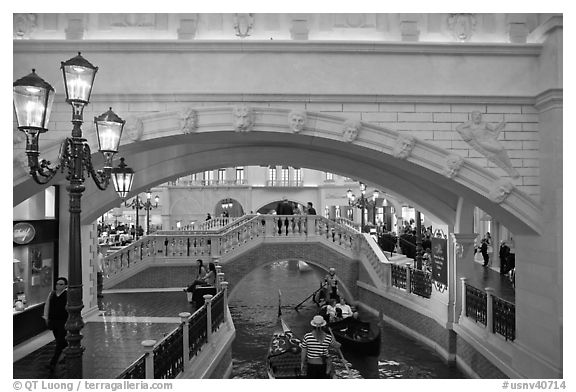 Gondolas passing below bridge, inside Venetian hotel. Las Vegas, Nevada, USA