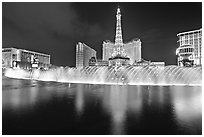 Bellagio dancing fountains and hotels reflected in lake. Las Vegas, Nevada, USA ( black and white)