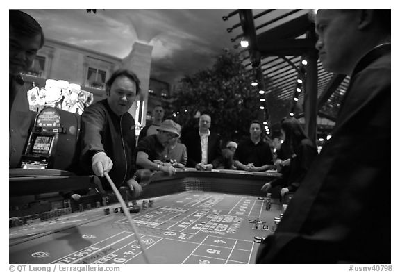 Dealer collecting during Craps game. Las Vegas, Nevada, USA