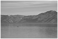 Kayak in the distance and mountains in winter, Lake Tahoe, Nevada. USA (black and white)