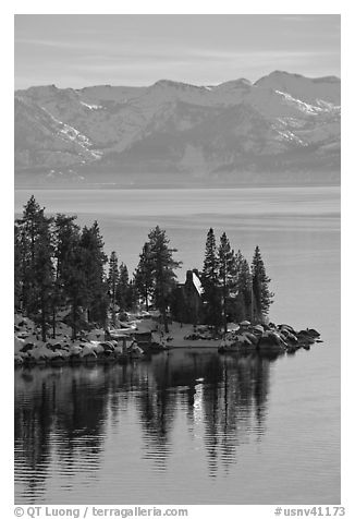 Cabin on lakeshore and snowy mountains, Lake Tahoe, Nevada. USA (black and white)