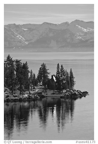 Cabin on lakeshore and snowy mountains, Lake Tahoe, Nevada. USA