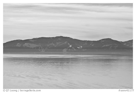 Distant mountains on lake rim in winter, Lake Tahoe, Nevada. USA (black and white)