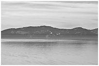 Distant mountains on lake rim in winter, Lake Tahoe, Nevada. USA ( black and white)