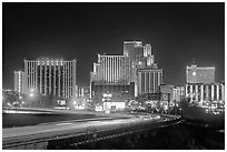 Illuminated casinos and freeway at night. Reno, Nevada, USA (black and white)