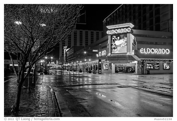 Main street with night reflections on wet pavement. Reno, Nevada, USA (black and white)