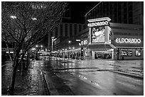 Main street with night reflections on wet pavement. Reno, Nevada, USA (black and white)