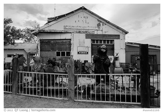 Wood sculptures and weathered building, Gerlach. Nevada, USA (black and white)