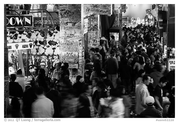 Holiday crowds in carnival game area. Reno, Nevada, USA (black and white)